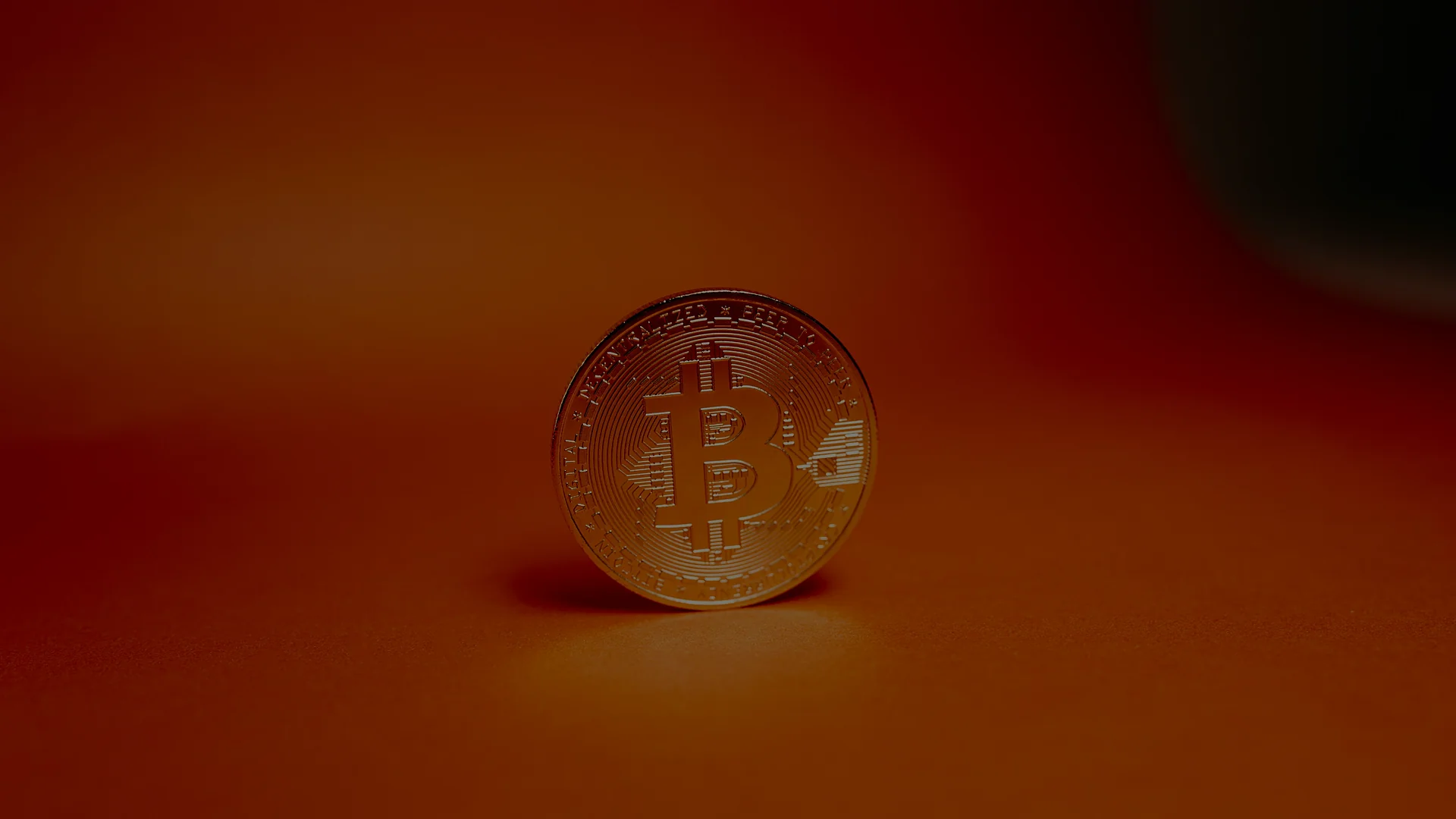 Photo of a coin with a Bitcoin logo